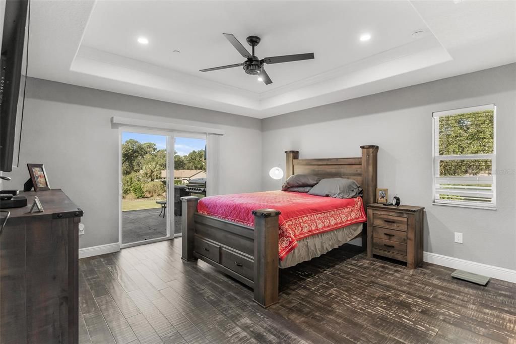 Primary Bedroom with Sliding Doors leading to Patio Area