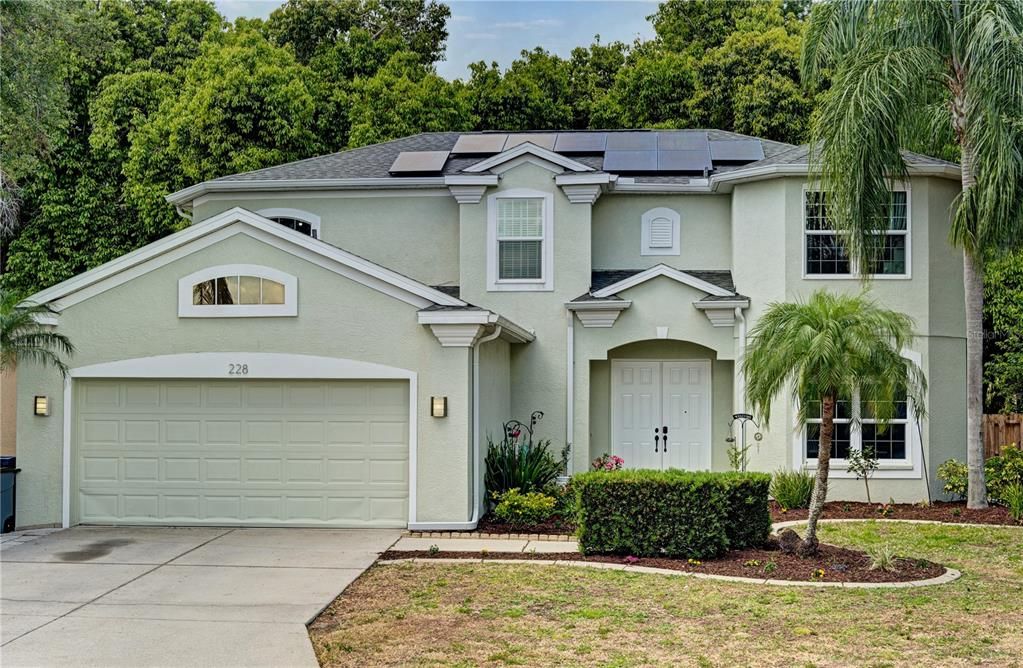 Front of the home, features hurricane rated windows