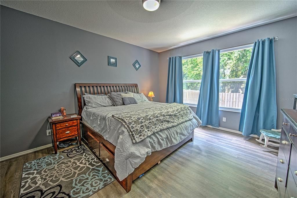 First floor primary bedroom with West facing windows, allowing for gentle light in the morning and beautiful sunsets in the evening