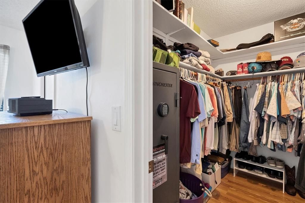 Primary bedroom walk-in closet