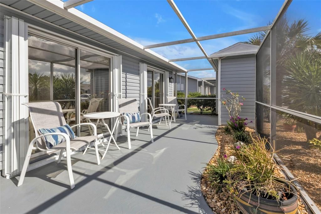 WELCOMING AND PRIVATE ENTRY WITH AREA FOR SITTING AN GARDENING , STORAGE SHED IN BACK CORNER