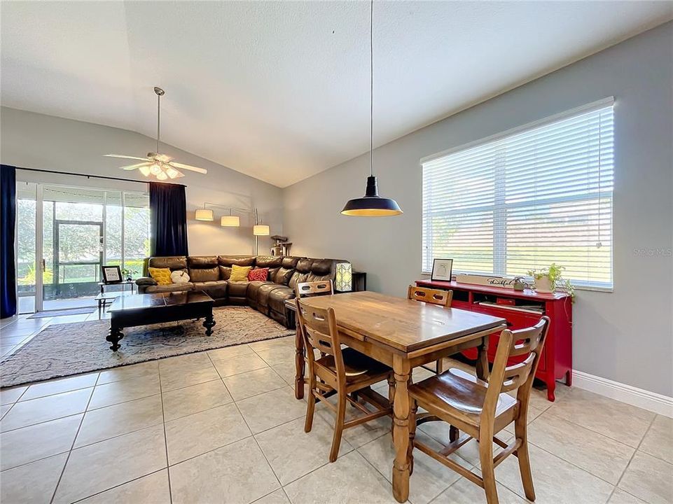 Eat in area looking into living room and screened in back porch