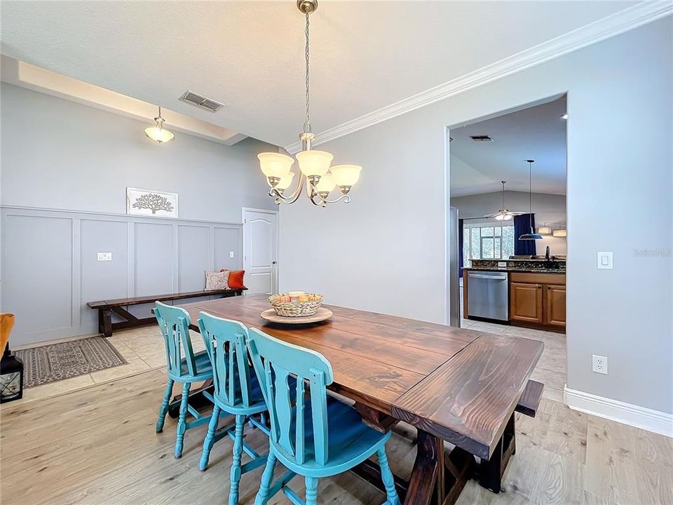 Dining room looking into kitchen and foyer