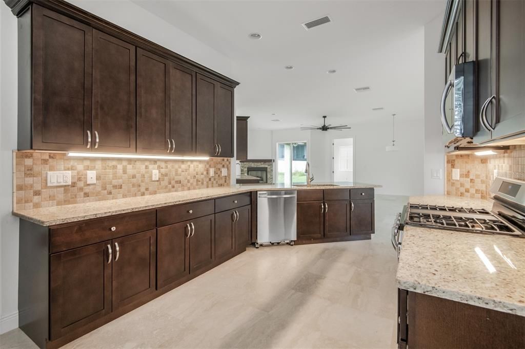 Full Kitchen with pantry and plenty of wood cabinets