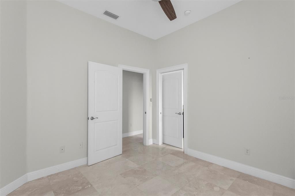 Guest Bedroom with Pocket door to guest bathroom