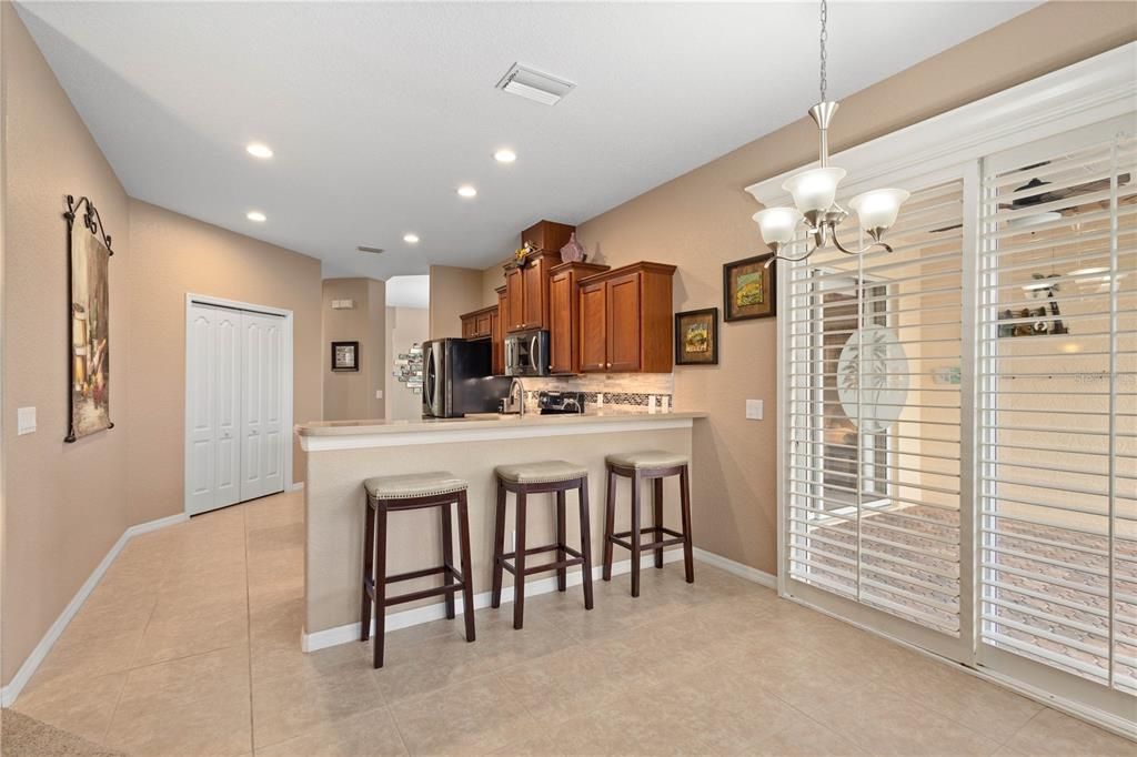 Breakfast bar off the kitchen and room for a table in the nook