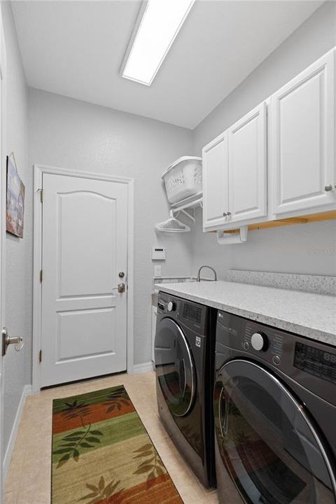 Top removes from the washer and dryer if needed.  Extra large laundry sink and plenty of cabinet and clothes storage