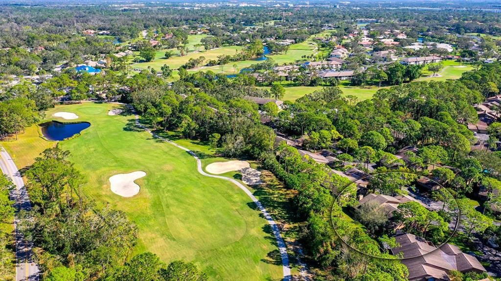 aerial view of home and golf course