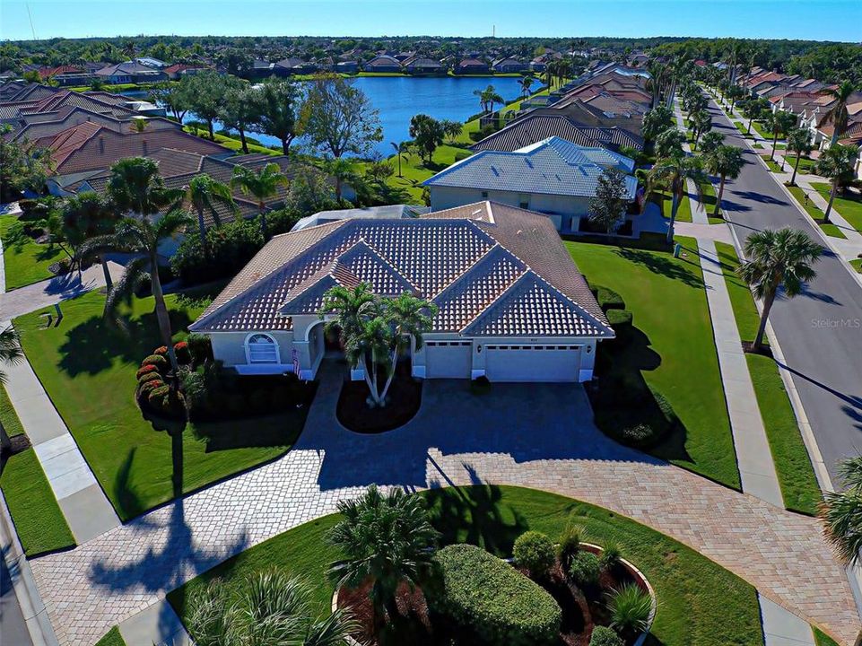 Spectacular home is set on a 1/3-acre, corner lot with water views and has a new tile roof.