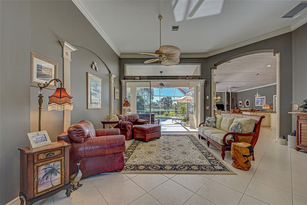 Wow!!! Your stunning view from the front door, looking into the formal living room, lanai, kitchen and family room.