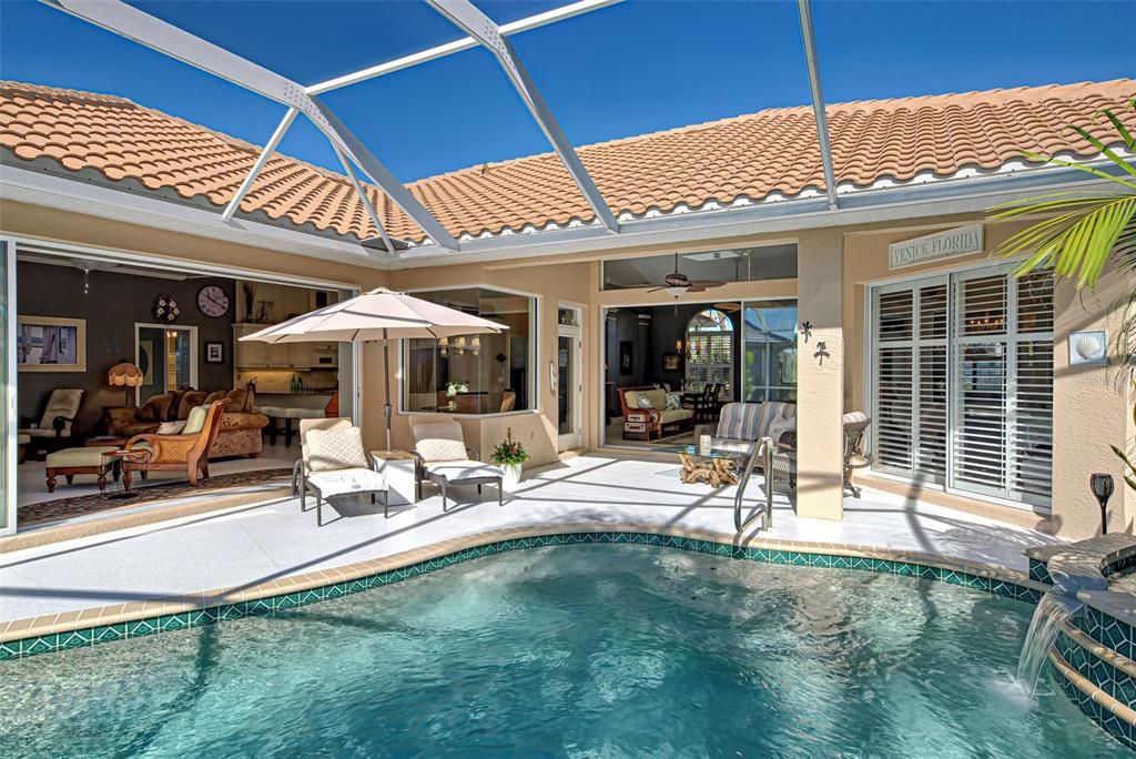 View from lanai looking into the family and living room.  Pool has brand new heater and pool pump replaced in 2022.