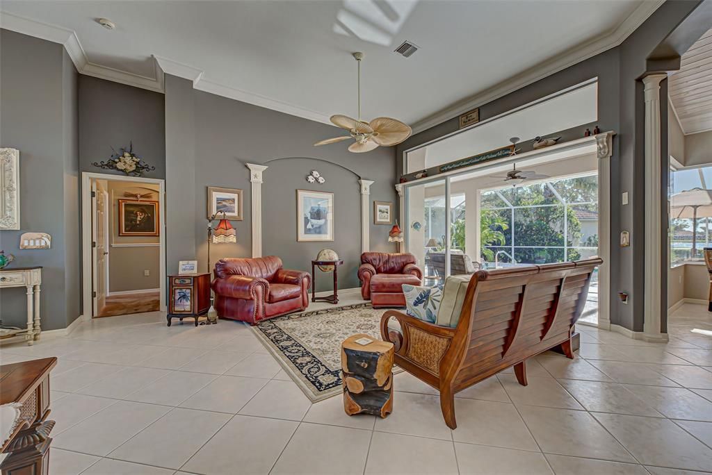 Soaring 12 foot ceilings, diagonal tile and crown molding make the living room so elegant.