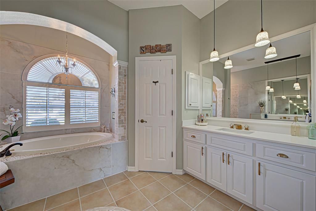 You will love the gorgeous quartz countertops, beautiful pendant lights, detailed tile work and the soaker tub.