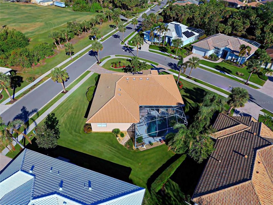 Another bird's eye view of the over-sized, corner lot with lush landscaping.