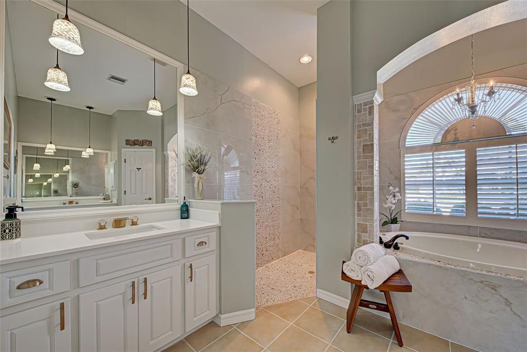 Dual, split vanities with plenty of storage and the large window lets the light flow in.