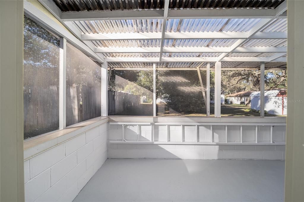 Screened Rear Patio with Corrugated Roof