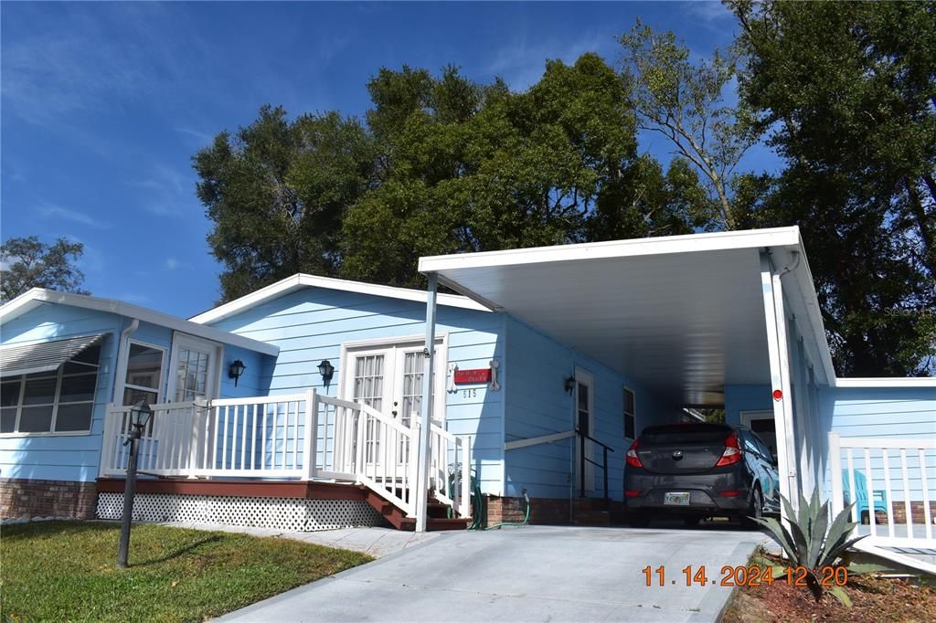 LAUNDRY ROOM TO THE RIGHT OF THE CARPORT