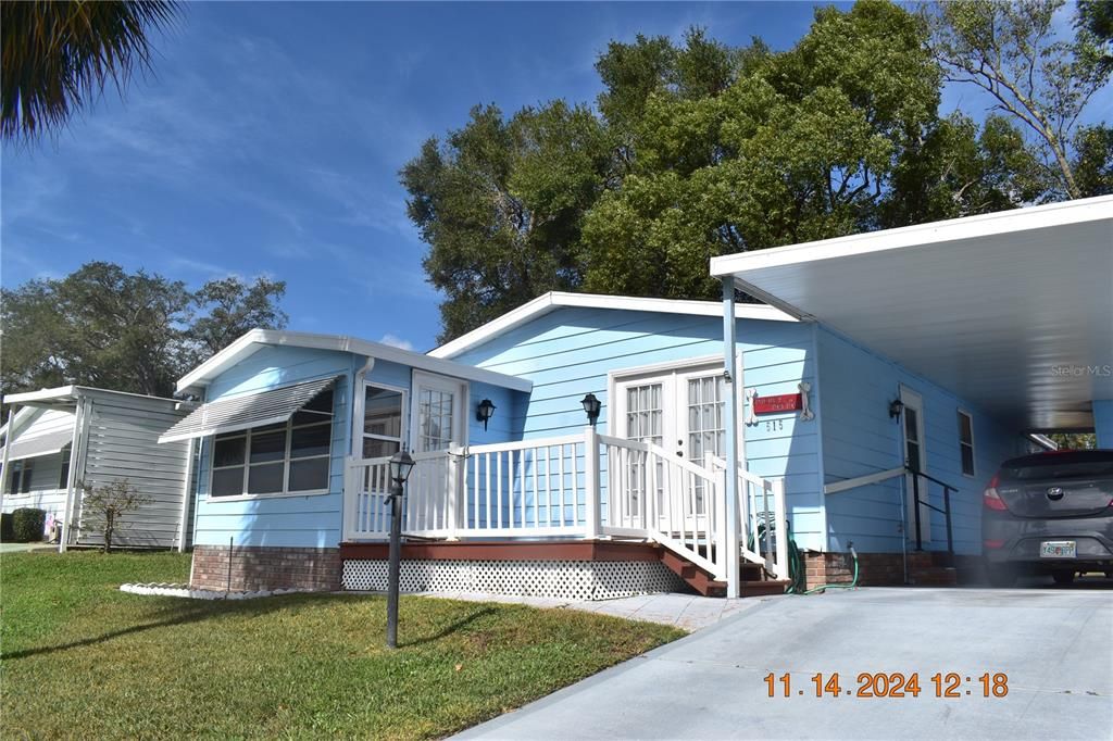 FRONT OF HOME AND CARPORT