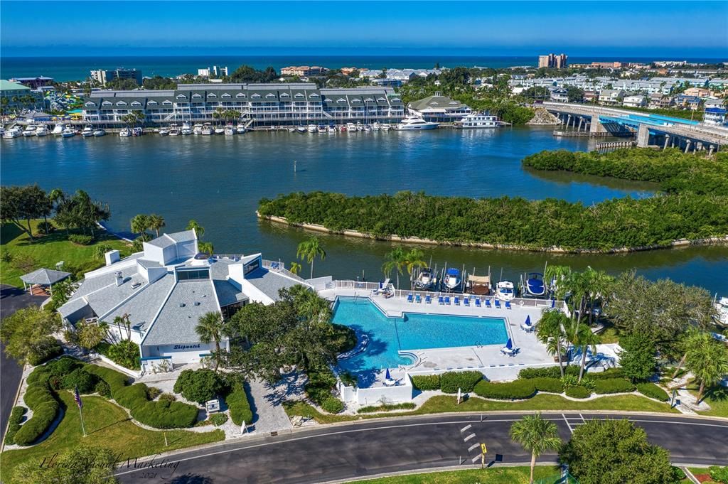 .. Aerial of Shipwatch Main Clubhouse-  Olympic Pool - and Private Boat Marina - Looking West at Indian Rocks Beach.