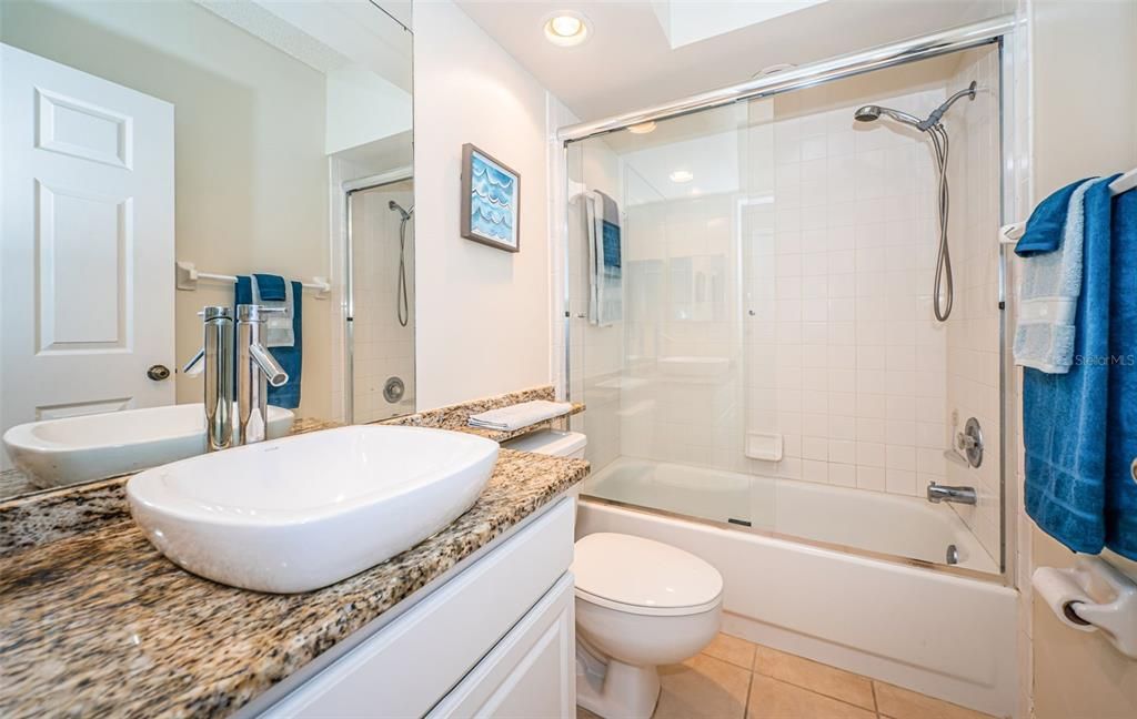 .. Guest Bathroom ... Tub with Shower..Master Suite has the walk in Shower..