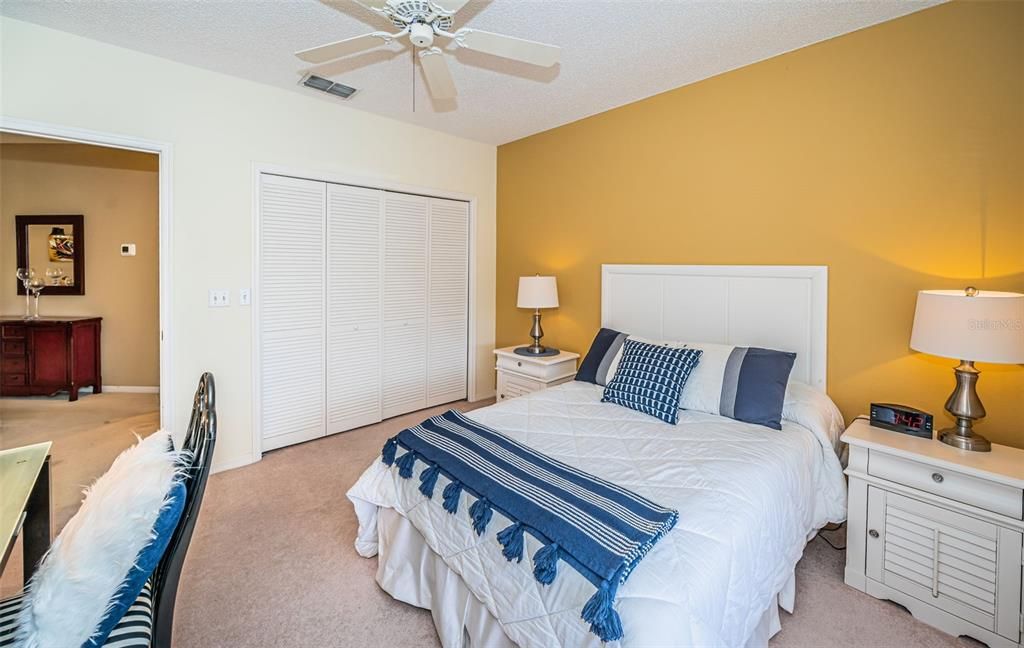 .. Guest Bedroom Looking out to Hallway by Cherry Wood Chest of Drawers.