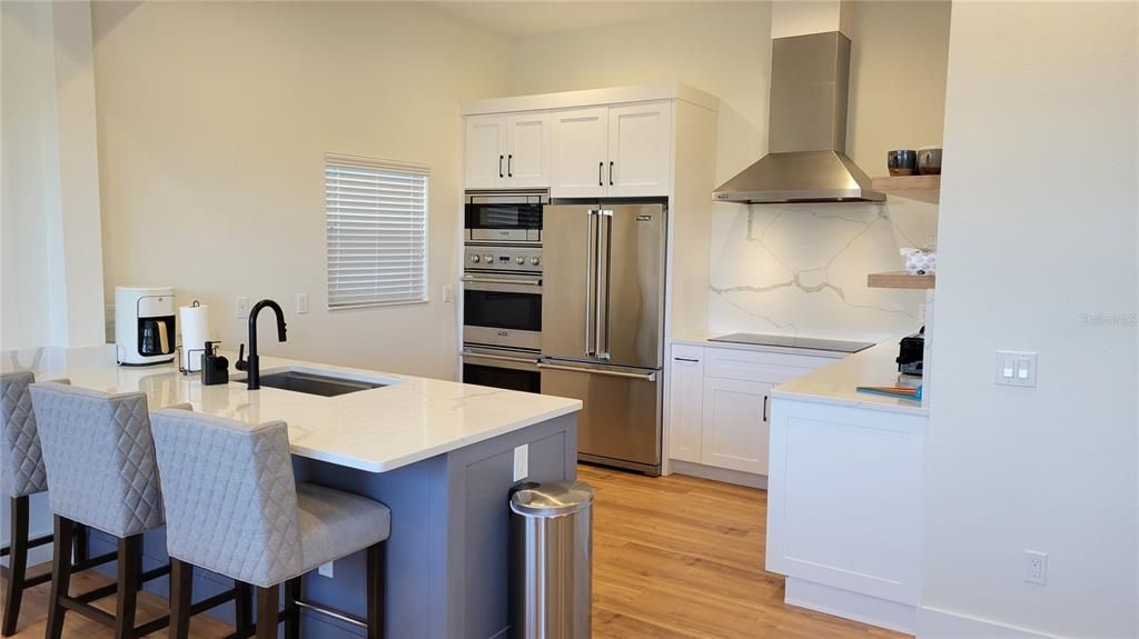 spacious open kitchen with double oven