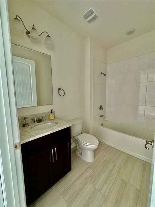 Hall bath with linen closet next to it.