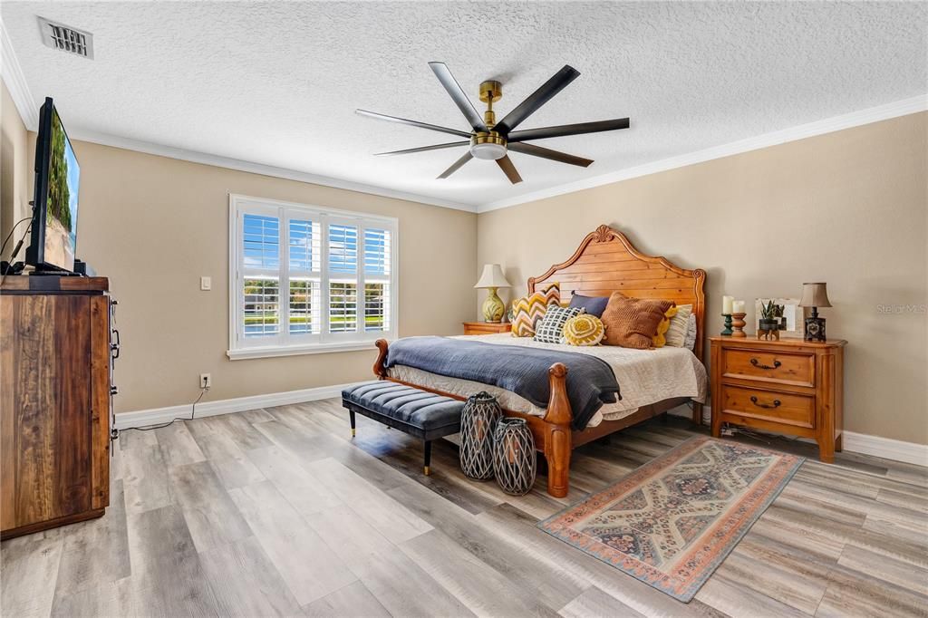 Primary bedroom with lots of natural sunlight.