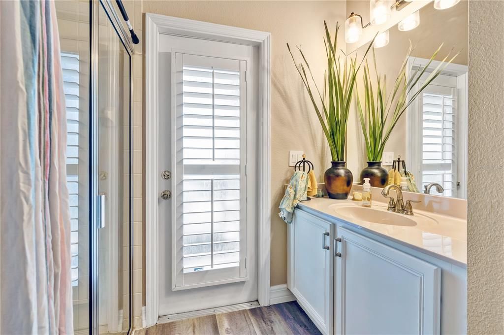 First floor full guest bathroom with direct access to the backyard.