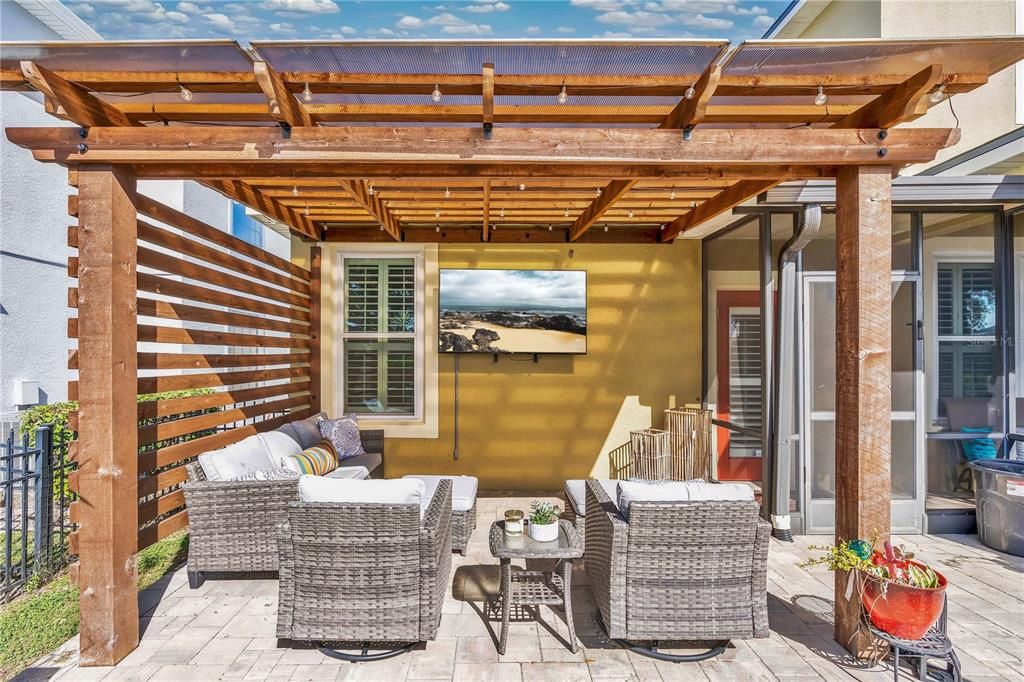 Large pergola on brick pavers, make a great entertainment area.