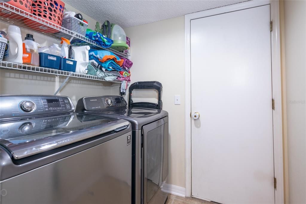 Inside laundry room by the garage