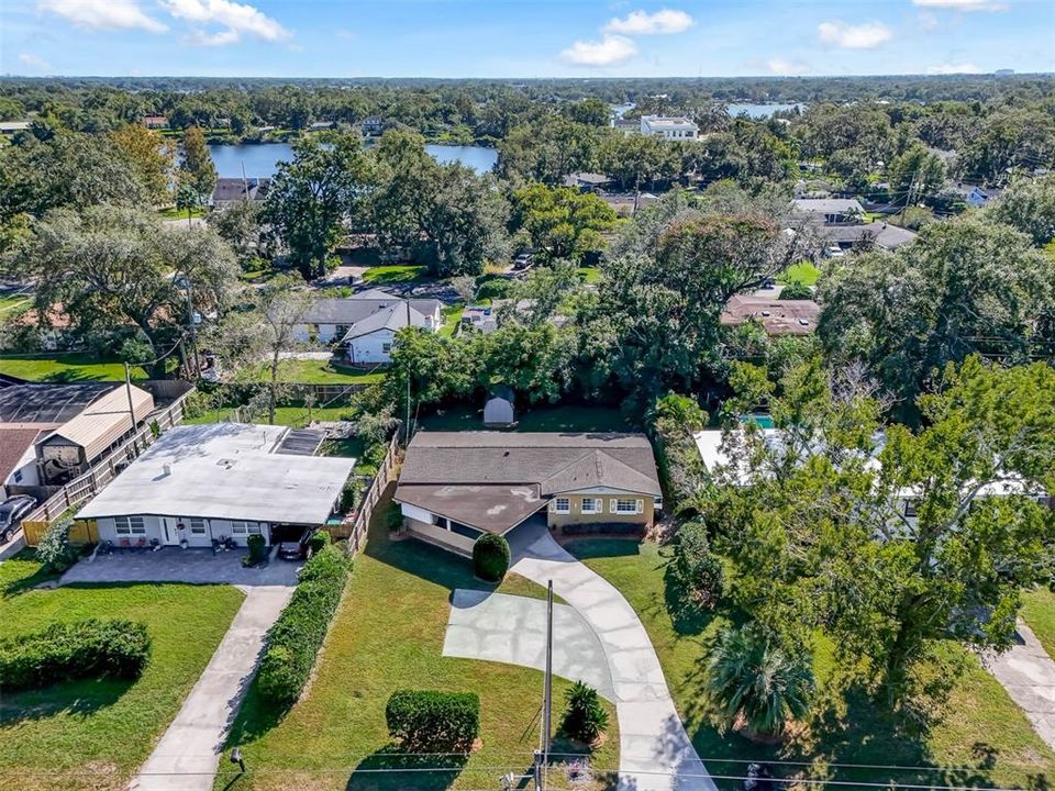 Drone Photo - Property is an amazing location surrounded by lakes, home sits back from the road with long driveway, plus additional parking pad