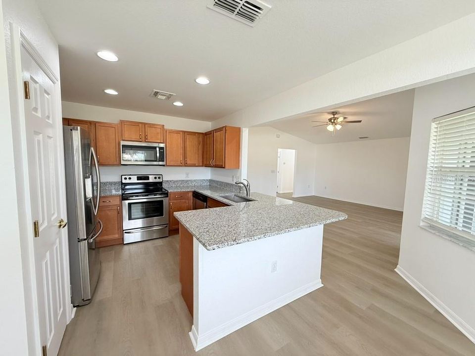 Kitchen opens to Family room and Dinette.