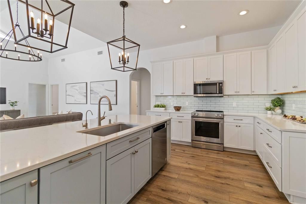 Kitchen with quartz countertops & stainless steel appliances