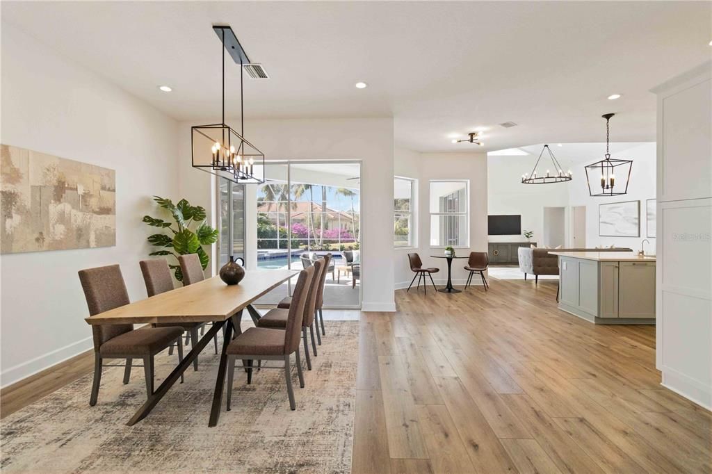 Open living/dining room opens to pool & lanai