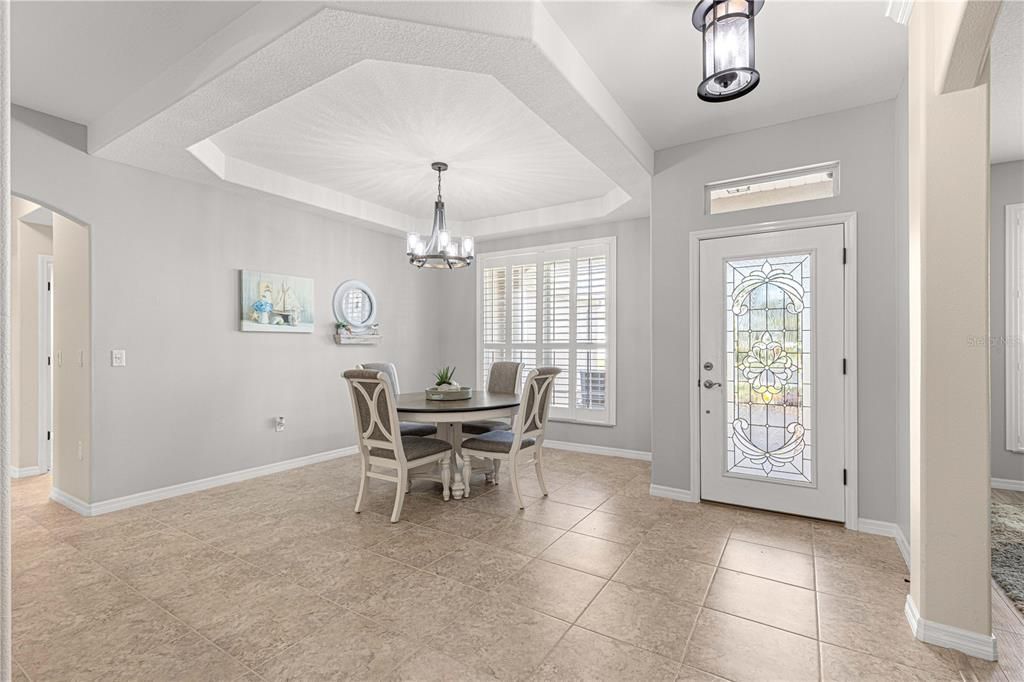 Formal Dining Room with elegant tray ceilings.