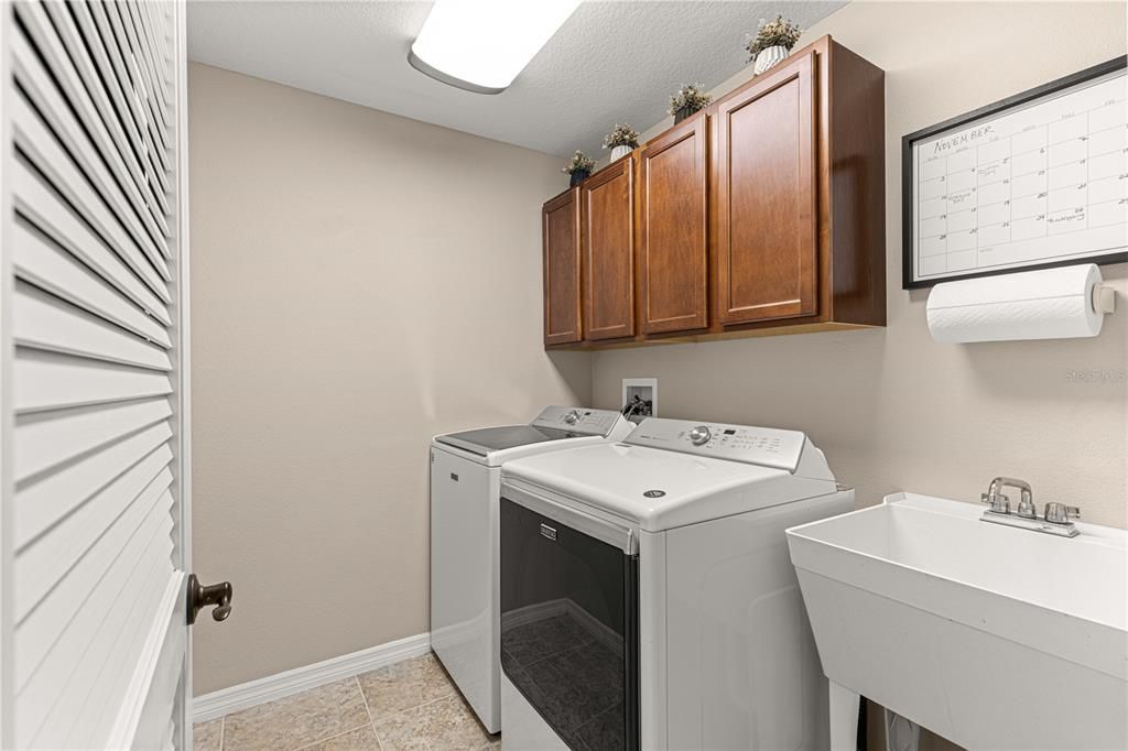 Laundry Room complete with a utility sink.