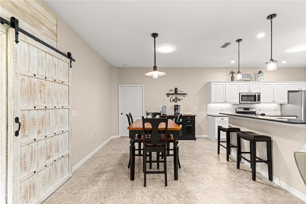 Barn doors, dinette and breakfast bar.