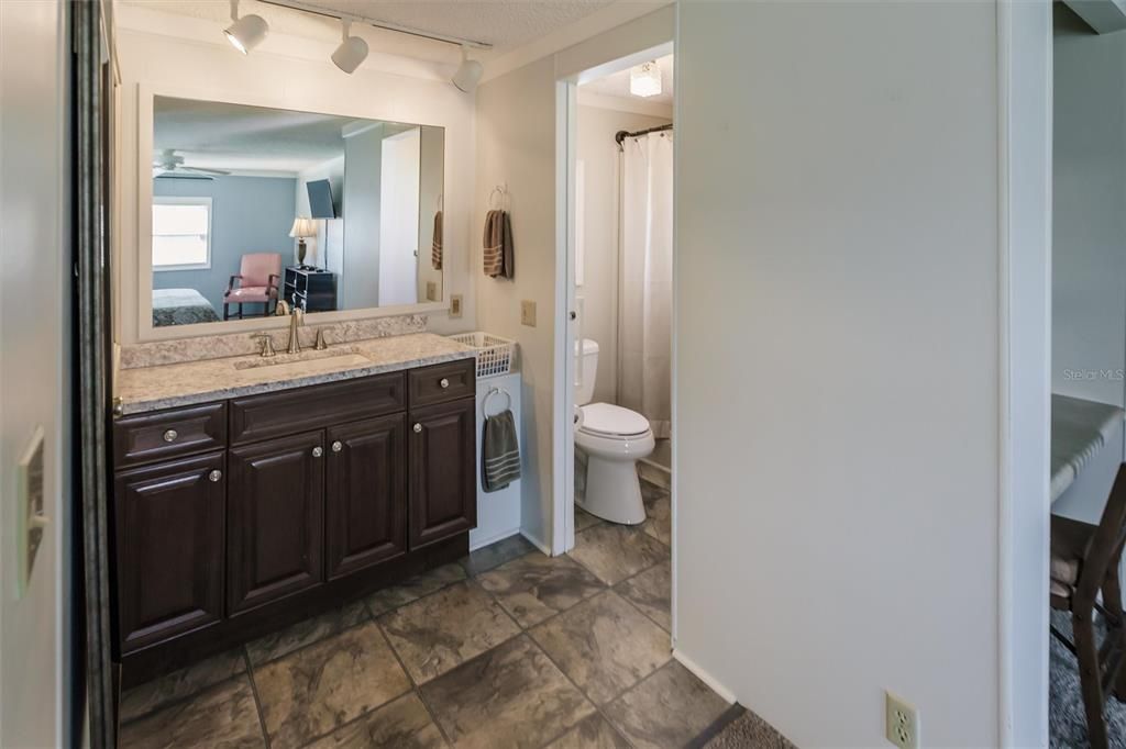 New vanity and fixtures, walk in shower and new comfort height toilet