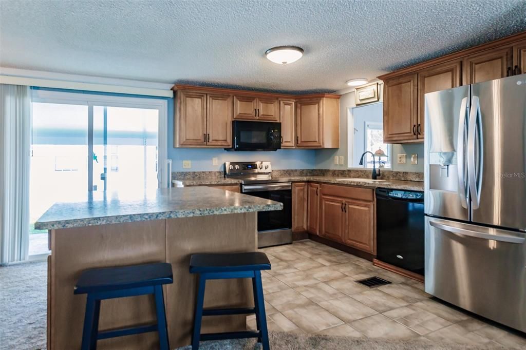 Kitchen and sliding doors to carport