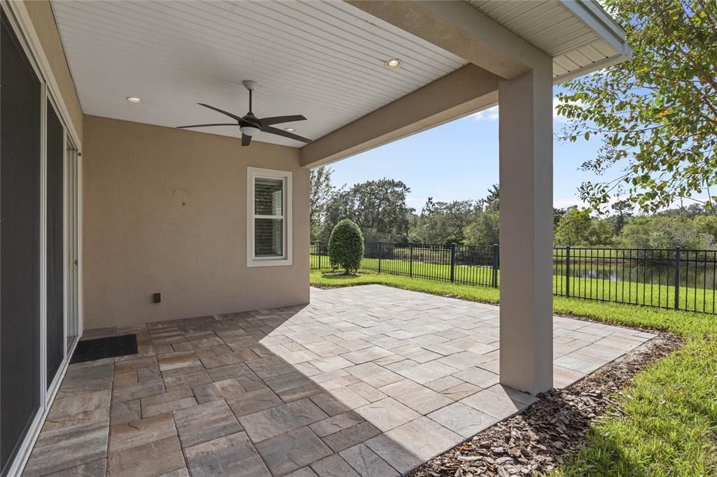 Covered lanai w/ brick paver patio & aluminum rail fence