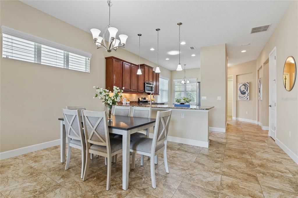 11' x 9' Dining Room w/ spacious breakfast bar & pendant lighting above