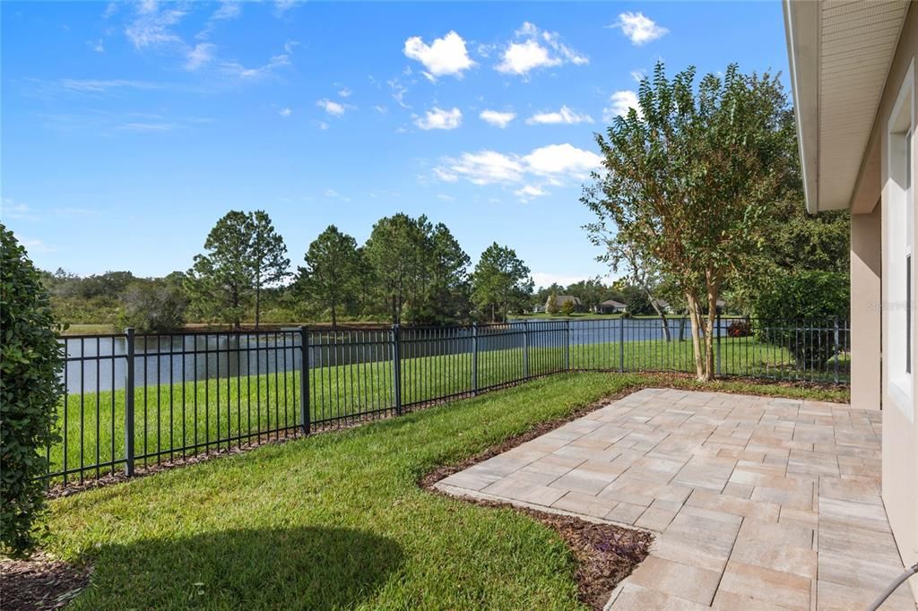 Fenced backyard w/ Pond & conservation area view