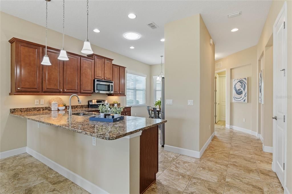 View of Foyer entryway & Kitchen areas with a solar tub