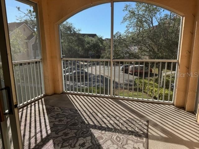 Screened -in lanai, grilling area and lake to the right.