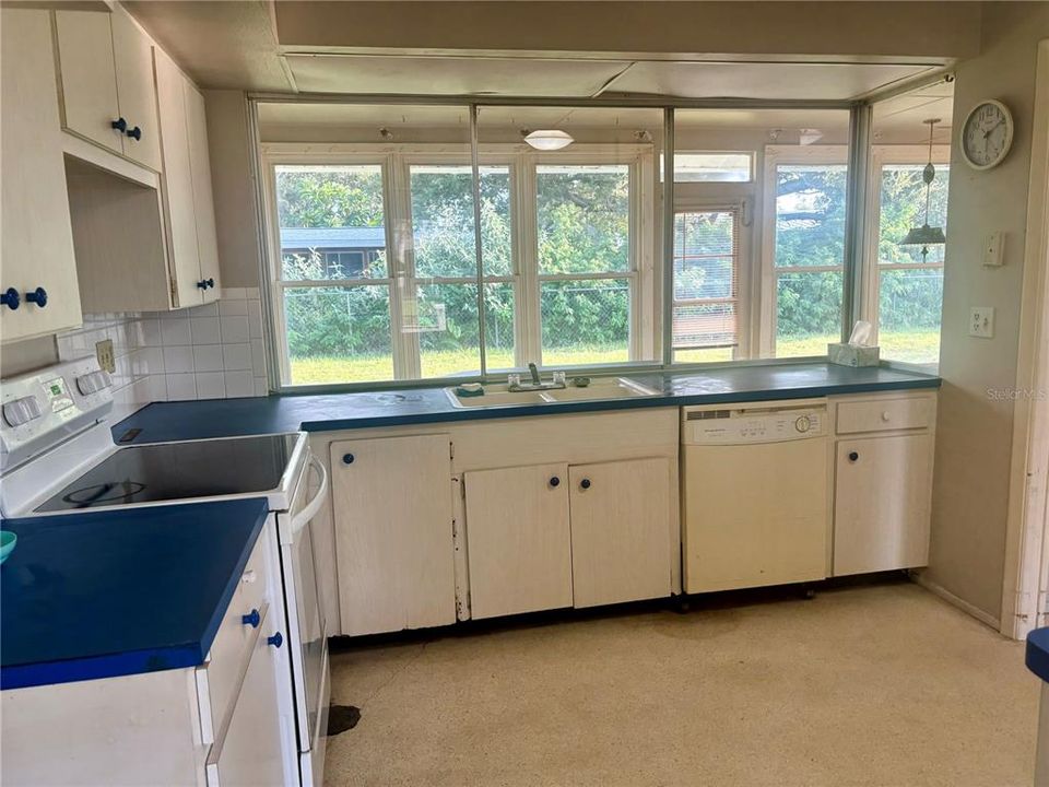 Kitchen opens to the Sunroom