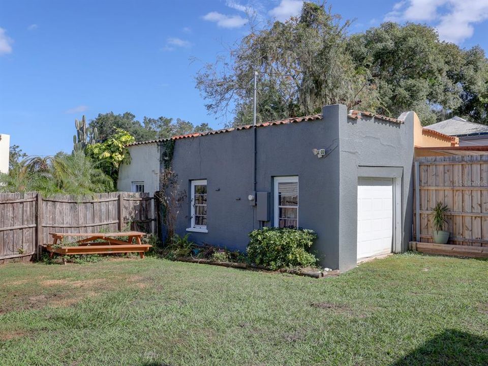 One car garage with view of the yard.