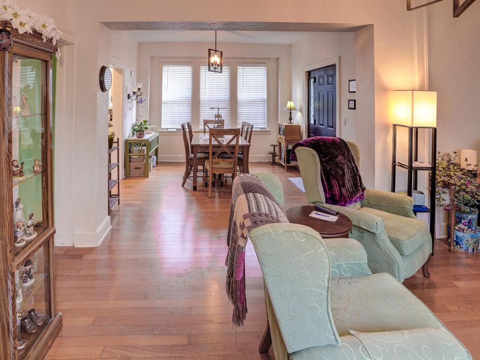 Living room with view of the dining room.