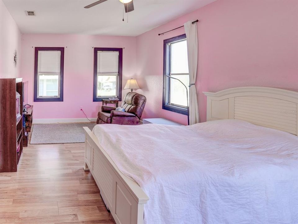 Primary bedroom upstairs with large walk in closet.