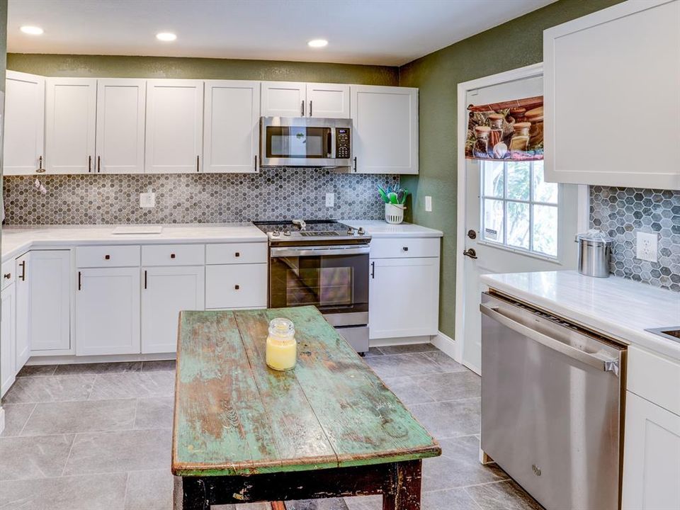 Kitchen with corian countertops. 1 1/2 year old appliances.